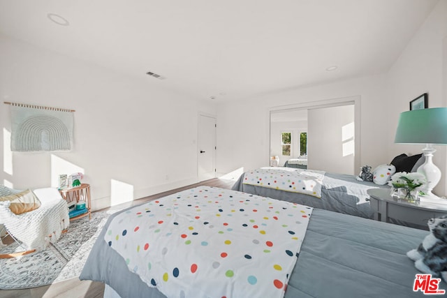 bedroom featuring wood-type flooring