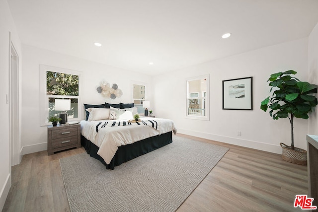 bedroom with light wood-type flooring