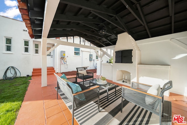 view of patio featuring electric panel and an outdoor hangout area