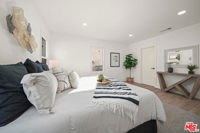 bedroom featuring hardwood / wood-style flooring