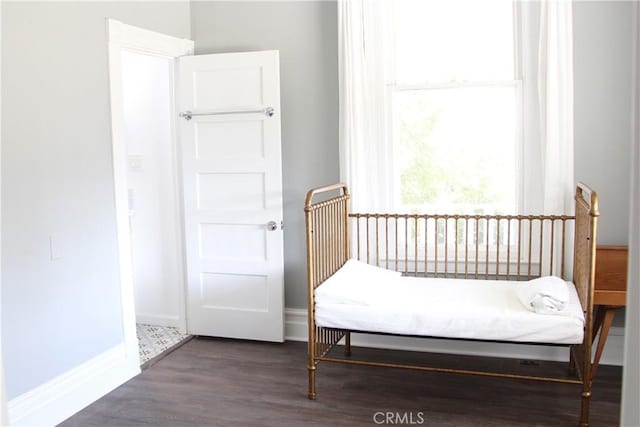 bedroom featuring dark hardwood / wood-style floors