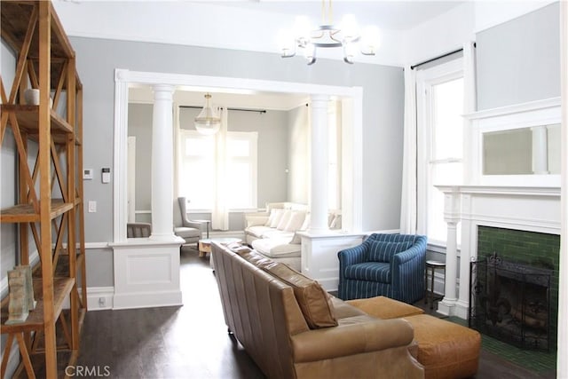 sitting room with dark hardwood / wood-style floors and a notable chandelier