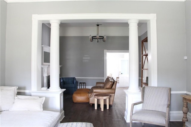 living room featuring dark wood-type flooring and an inviting chandelier