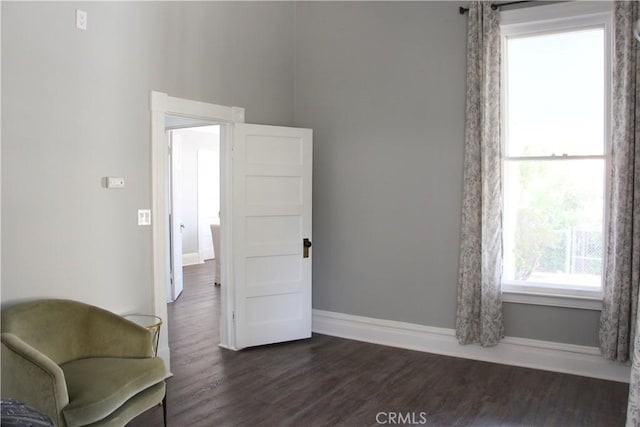 sitting room with dark hardwood / wood-style floors