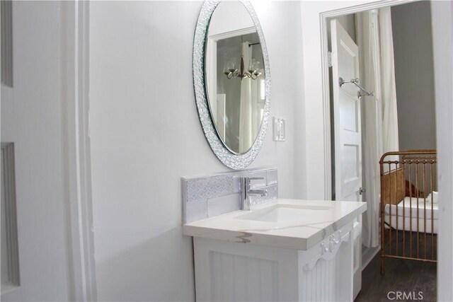 bathroom featuring vanity and hardwood / wood-style flooring