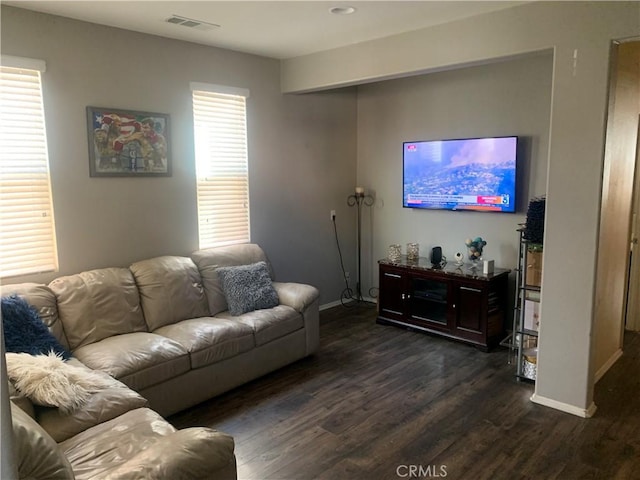 living room with dark hardwood / wood-style flooring