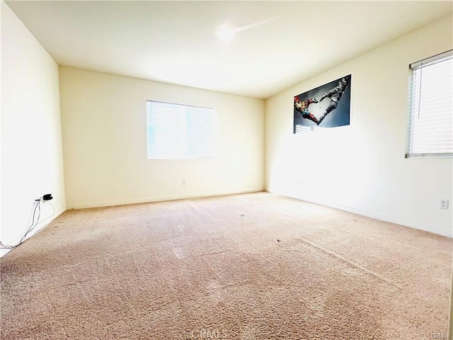 spare room featuring carpet floors