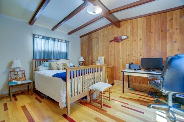 bedroom featuring wood-type flooring, lofted ceiling with beams, and wooden walls