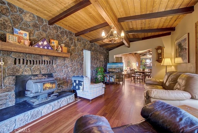 living room with an inviting chandelier, hardwood / wood-style flooring, vaulted ceiling with beams, a fireplace, and wood ceiling