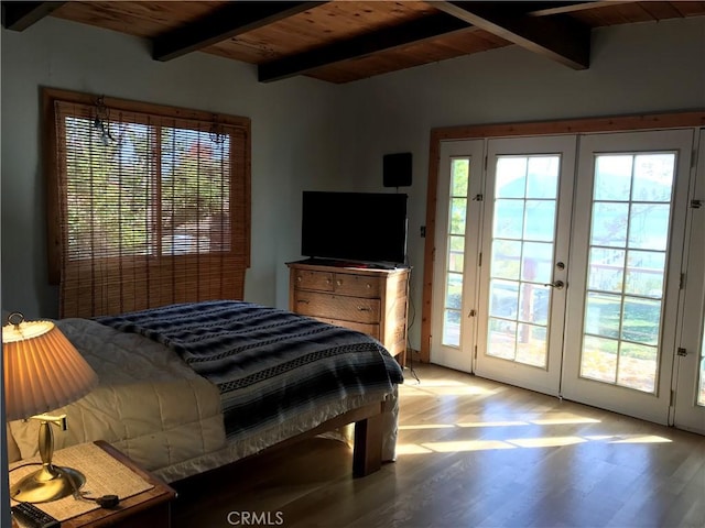 bedroom featuring french doors, lofted ceiling with beams, hardwood / wood-style floors, access to outside, and wood ceiling