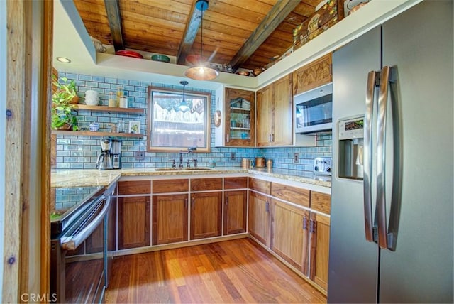 kitchen with wooden ceiling, stainless steel appliances, tasteful backsplash, pendant lighting, and light wood-type flooring