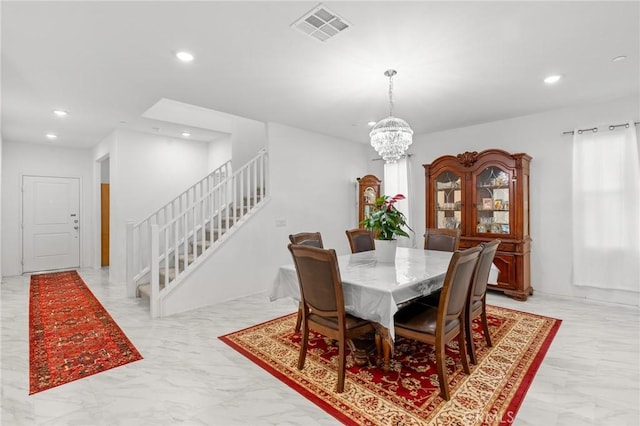 dining area featuring a chandelier