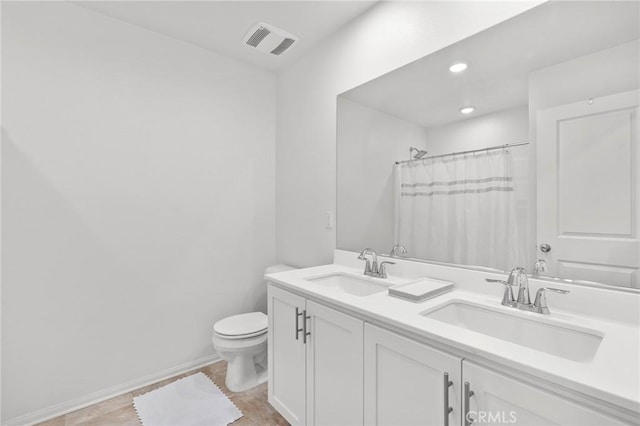 bathroom with tile patterned flooring, vanity, a shower with shower curtain, and toilet