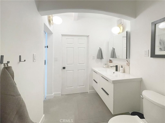 bathroom with vanity and toilet