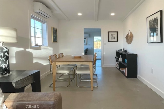 dining area featuring a wall unit AC and concrete flooring