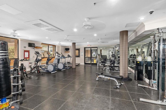 gym featuring ceiling fan and ornamental molding