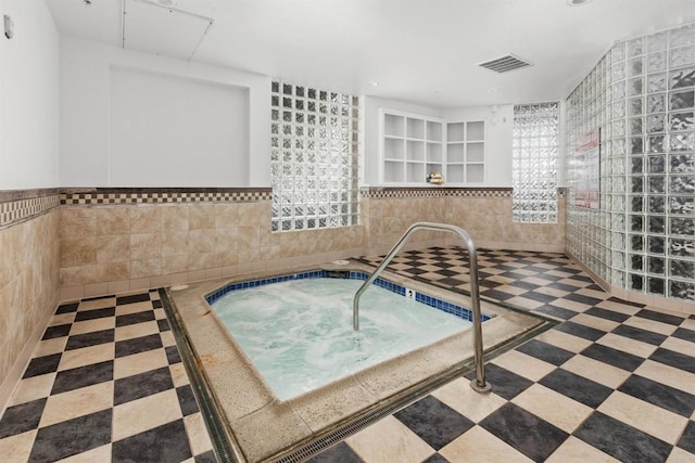 interior space featuring an indoor in ground hot tub