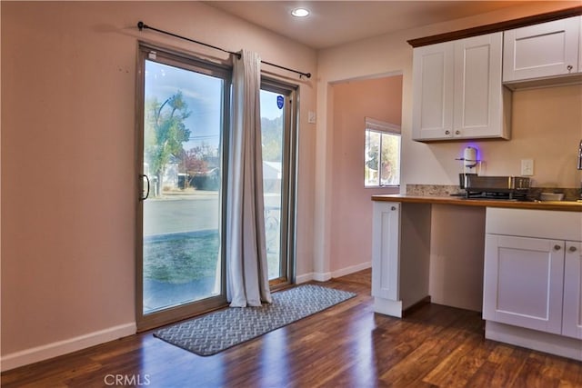 kitchen with white cabinetry and dark hardwood / wood-style floors