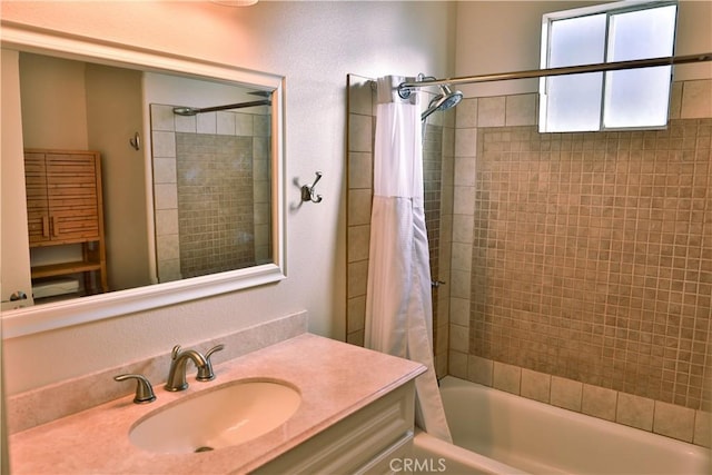 bathroom featuring vanity and shower / tub combo