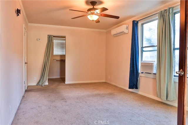 spare room featuring a wall mounted AC, crown molding, ceiling fan, and light carpet