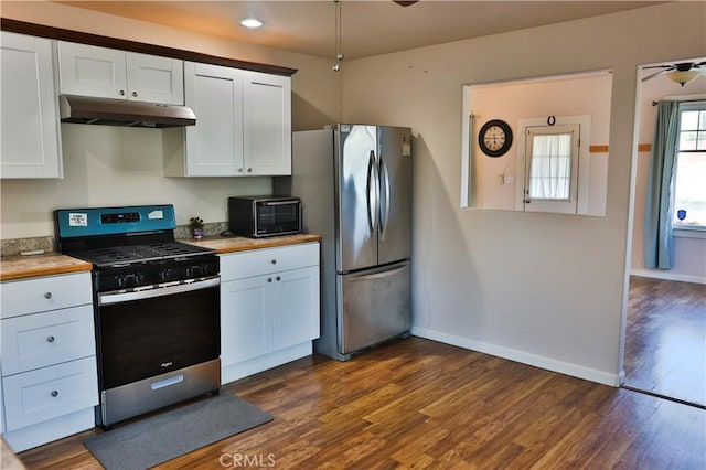 kitchen with dark hardwood / wood-style floors, white cabinetry, and stainless steel appliances