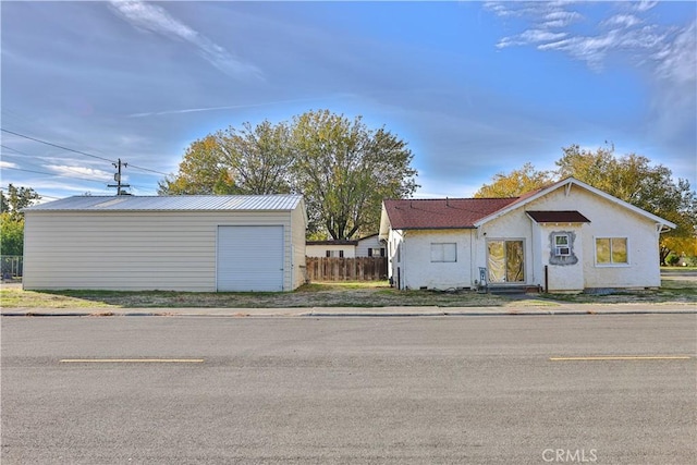 exterior space with an outdoor structure and a garage