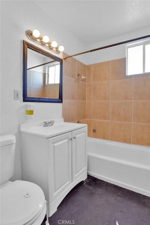 bathroom featuring tub / shower combination, concrete floors, vanity, and toilet