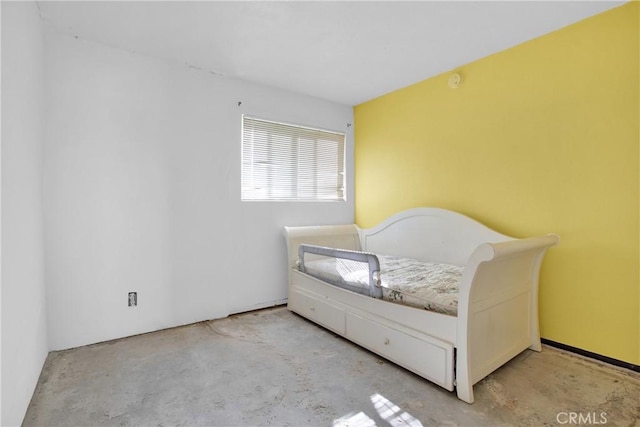 bedroom with concrete floors