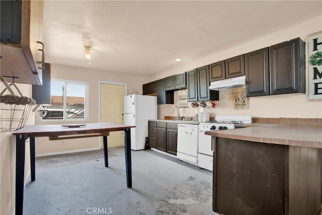 kitchen with dark brown cabinetry, under cabinet range hood, white appliances, concrete floors, and light countertops