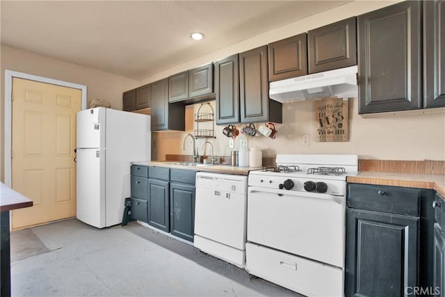 kitchen featuring concrete flooring, under cabinet range hood, white appliances, a sink, and light countertops