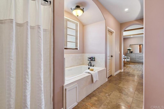 bathroom with a tub