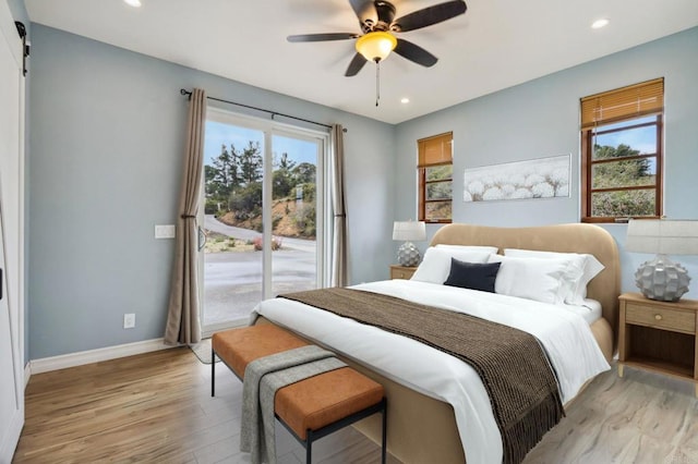 bedroom featuring baseboards, access to outside, recessed lighting, and light wood-style floors