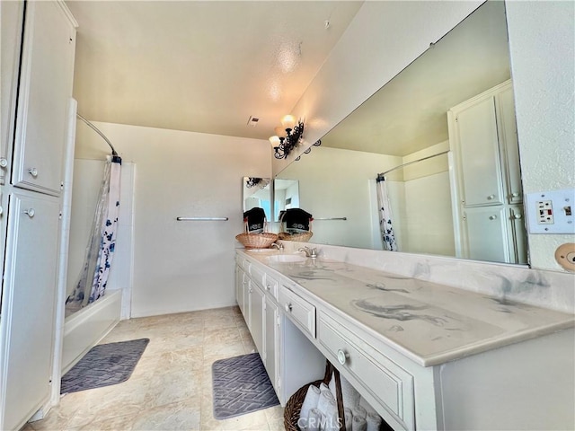 bathroom with shower / tub combo and vanity