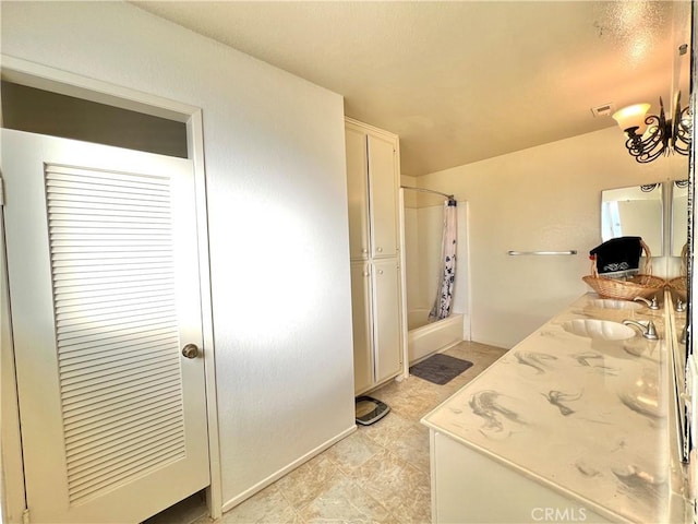 bathroom featuring shower / bathtub combination with curtain and vanity