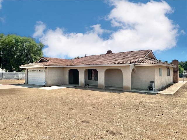 mediterranean / spanish-style house featuring a garage