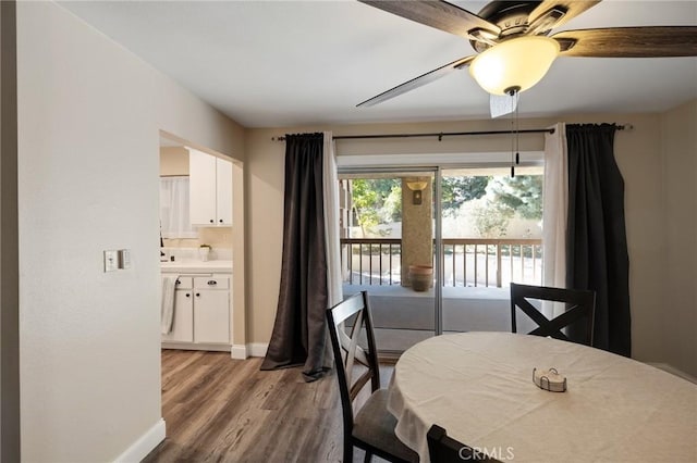 dining room with light wood-type flooring and ceiling fan