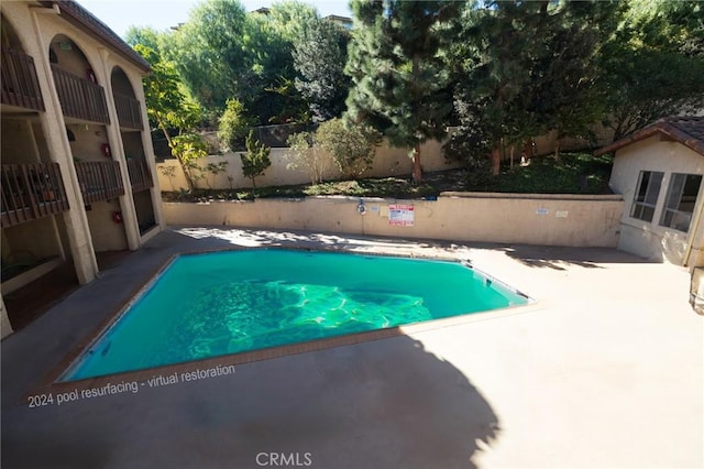 view of pool featuring a patio area