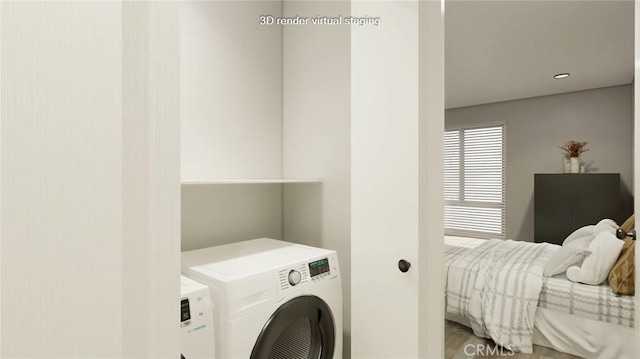 laundry room with washing machine and dryer