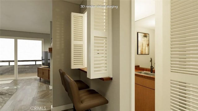 interior space with sink and hardwood / wood-style flooring