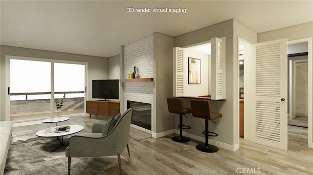 living room featuring a fireplace and light hardwood / wood-style floors