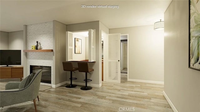 interior space featuring light wood-type flooring and a brick fireplace