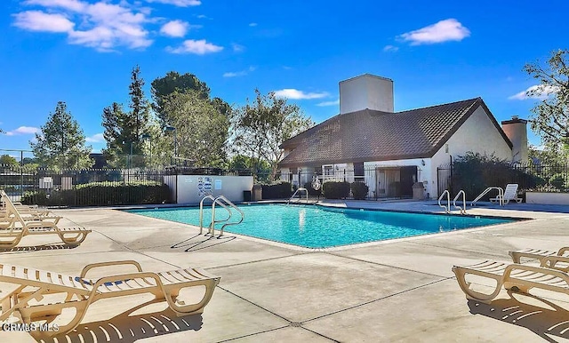 view of swimming pool featuring a patio area