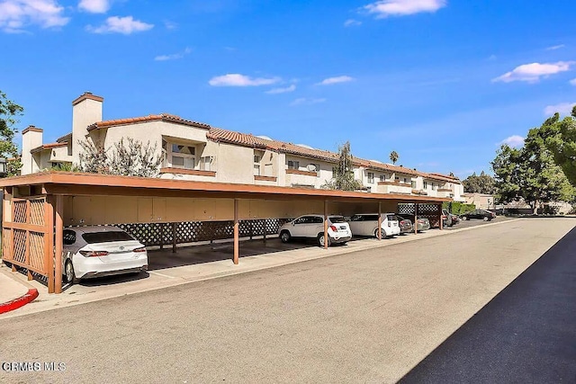 view of parking / parking lot with a carport