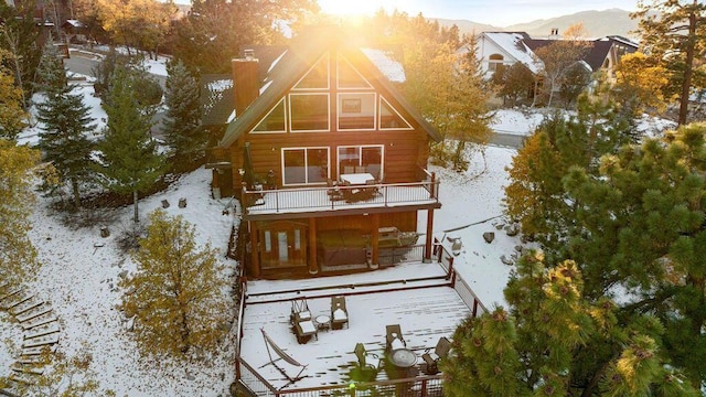 exterior space with a mountain view and a balcony