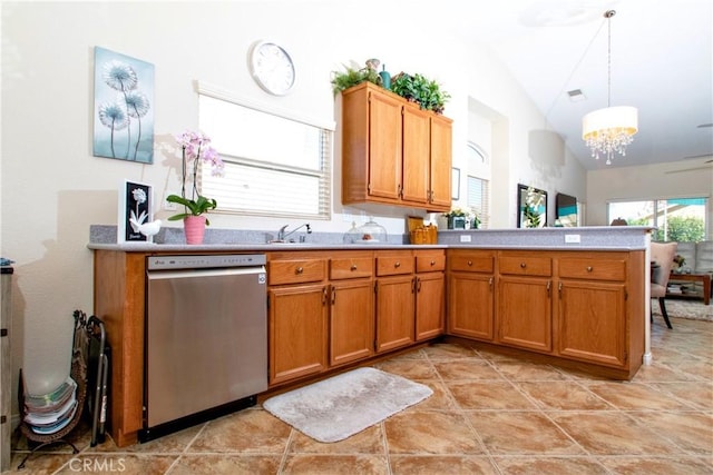 kitchen featuring hanging light fixtures, stainless steel dishwasher, kitchen peninsula, a chandelier, and vaulted ceiling