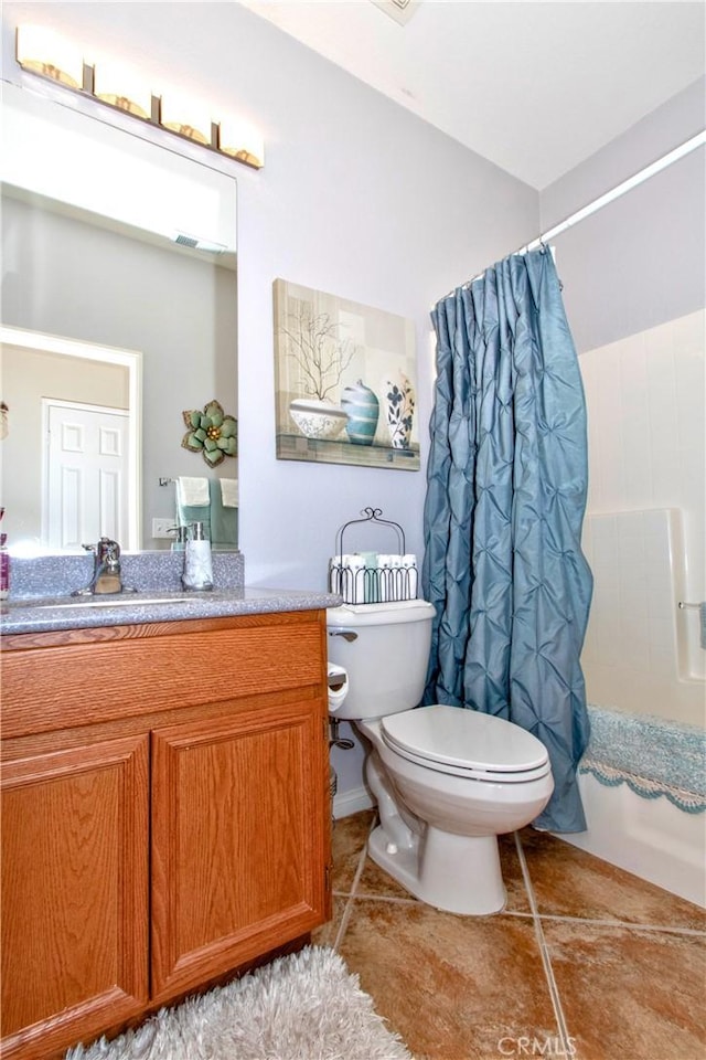 full bathroom with tile patterned flooring, vanity, shower / bath combo, and toilet