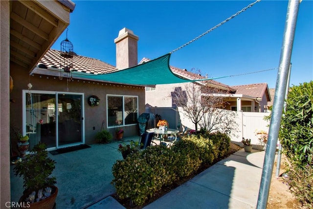 rear view of house featuring a patio