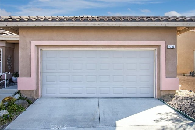 garage with driveway