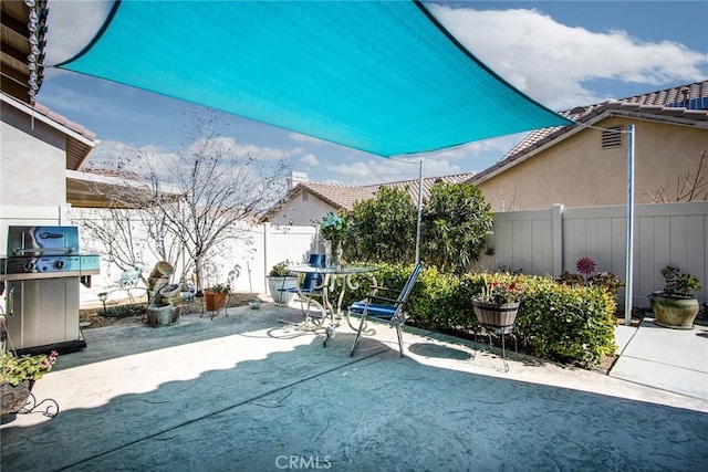 view of patio with a fenced backyard