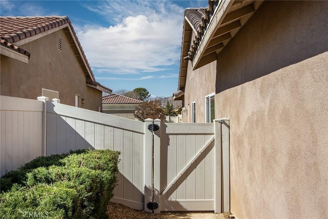 view of gate featuring fence